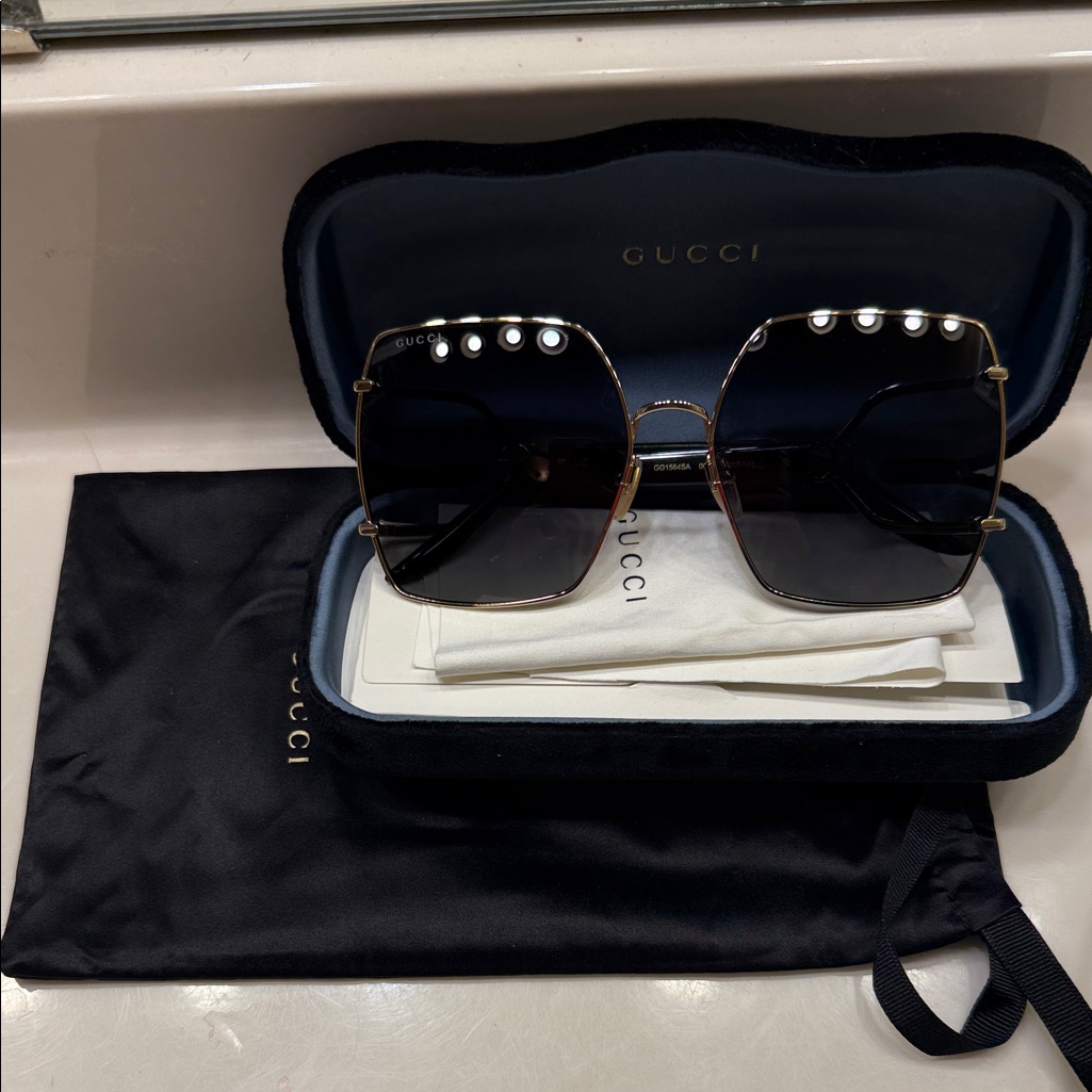 Gucci Women's Sunglasses With Black Lenses And Gold Frame
